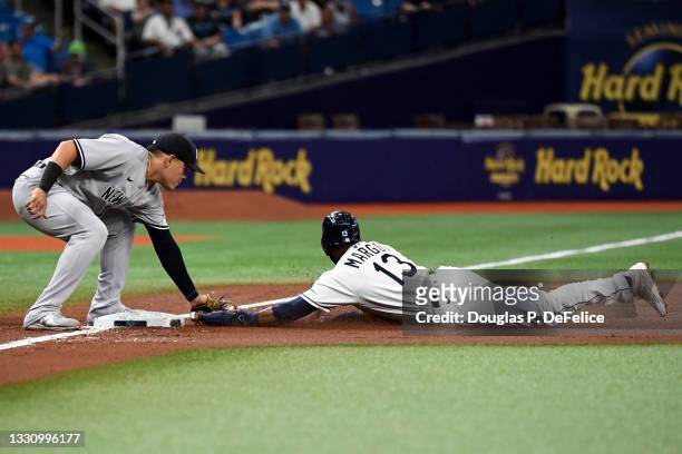 Manuel Margot of the Tampa Bay Rays is caught stealing third base by Gio Urshela of the New York Yankees in the first inning at Tropicana Field on...