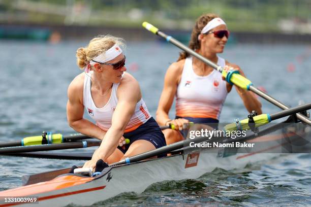 Lisa Scheenaard and Roos de Jong of Team Netherlands look back during the Women's Double Sculls Final A on day five of the Tokyo 2020 Olympic Games...