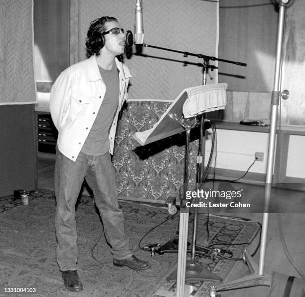 Australian musician, singer-songwriter and actor Michael Hutchence sings in studio circa 1996 in Los Angeles, California.