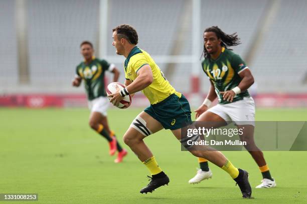 Dylan Pietsch of Team Australia runs with the ball during the Rugby Sevens Men's Placing 5-8 match between South Africa and Australia on day five of...