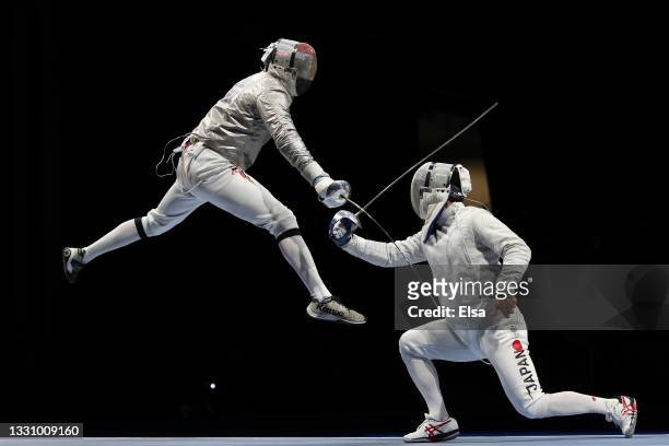 Ziad Elsissy of Team Egypt, left, competes against Kaito Streets of Team Japan in Men's Sabre Team on day five of the Tokyo 2020 Olympic Games at...