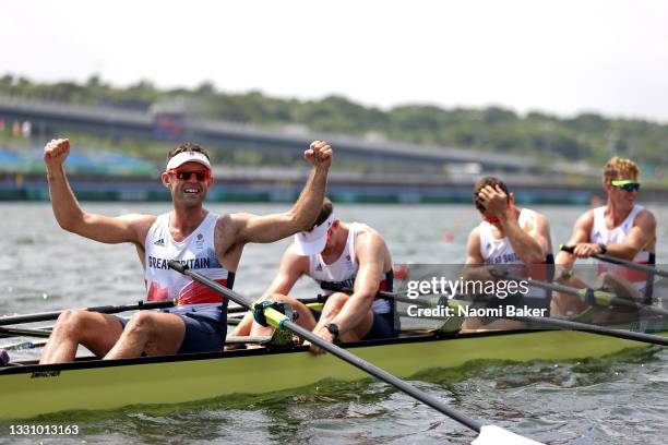 Jack Beaumont, Tom Barras, Angus Groom and Harry Leask of Team Great Britain celebrate winning the silver medal during the Men's Quadruple Sculls...