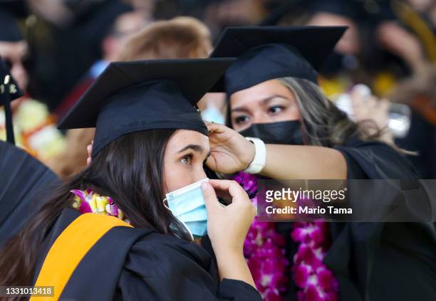 Cal State Los Angeles graduates prepare for their commencement ceremony which was held outdoors beneath a tent on campus on July 27, 2021 in Los...