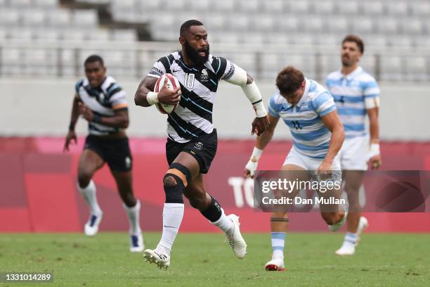 Semi Radradra of Team Fiji makes a break to score a try during the Rugby Sevens Men's Semi-final match between Argentina and Fiji on day five of the...