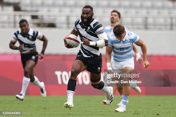 Semi Radradra of Team Fiji makes a break to score a try during the Rugby Sevens Men's Semi-final match between Argentina and Fiji on day five of the...