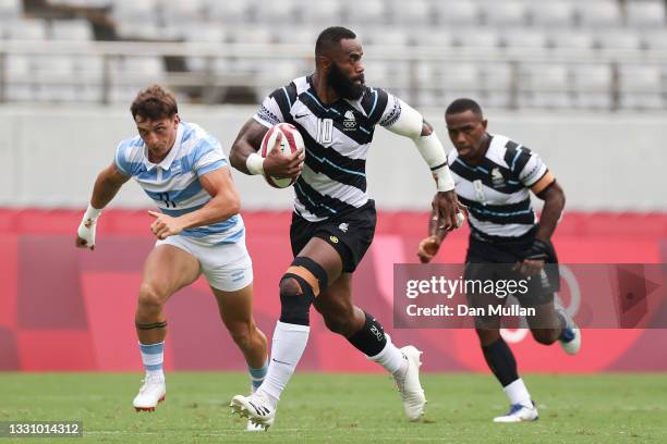 Semi Radradra of Team Fiji makes a break to score a try during the Rugby Sevens Men's Semi-final match between Argentina and Fiji on day five of the...