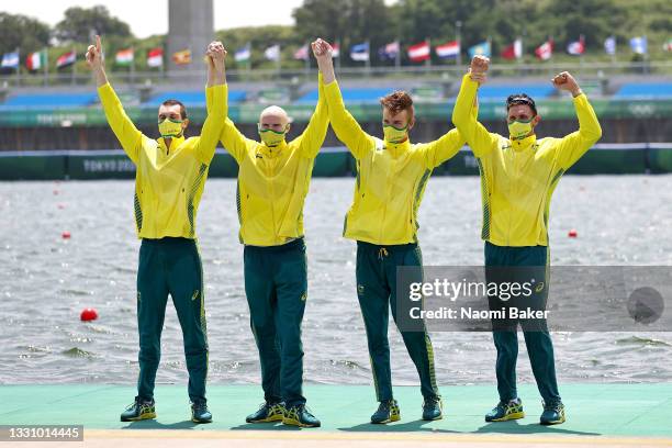 Alexander Purnell, Spencer Turrin, Jack Hargreaves and Alexander Hill of Team Australia celebrate winning the gold medal during the medal ceremony...