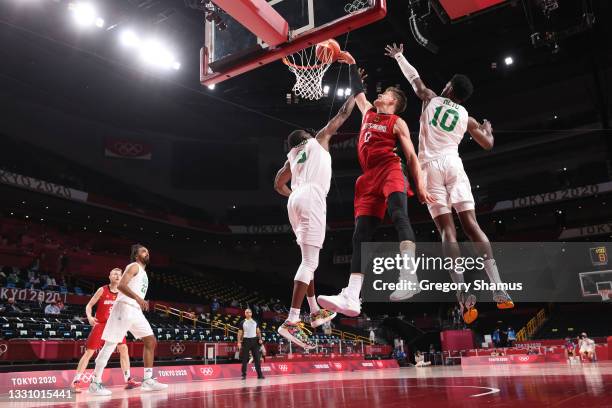 Moritz Wagner of Team Germany dunks against Ekpe Udoh and Chimezie Metu of Team Nigeria during the second half of a Men's Preliminary Round Group B...