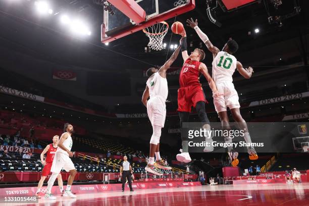 Moritz Wagner of Team Germany dunks against Ekpe Udoh and Chimezie Metu of Team Nigeria during the second half of a Men's Preliminary Round Group B...