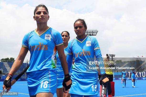 Udita, Nisha and members of Team India walk off the field after losing 4-1 the Women's Preliminary Pool A match between Great Britain and India on...