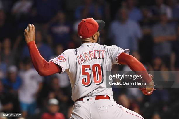 Amir Garrett of the Cincinnati Reds pitches in the ninth inning against the Chicago Cubs at Wrigley Field on July 27, 2021 in Chicago, Illinois.