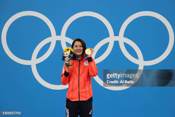 Yui Ohashi of Team Japan poses with the gold medal during the medal ceremony for the Women's 200m Individual Medley Final on day five of the Tokyo...