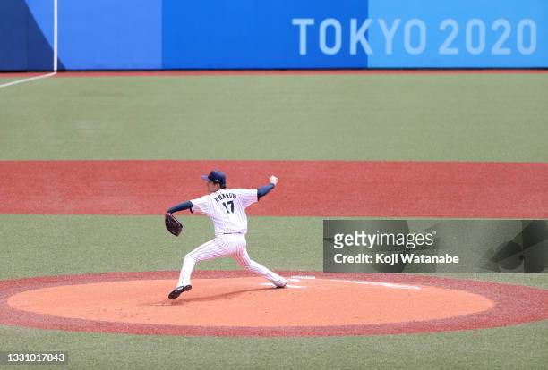 Pitcher Yoshinobu Yamamoto of Team Japan pitches in the first inning against Team Dominican Republic during the baseball opening round Group A game...