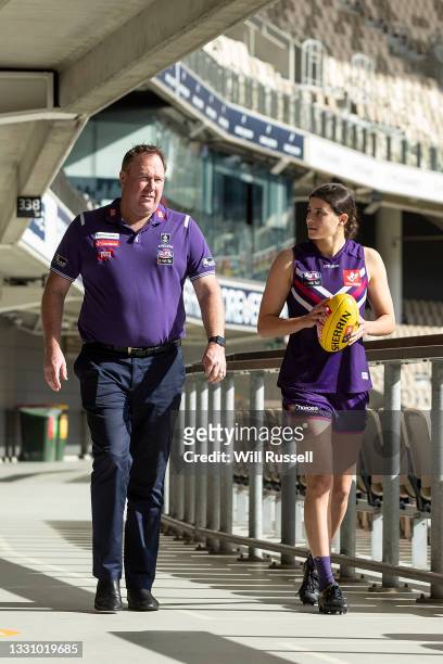 Fremantle Dockers first AFLW pick, Amy Franklin walks with coach Trent Cooper during a Fremantle Dockers AFLW Draft media opportunity at Optus...