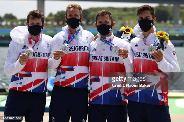 Silver medalists Tom Barras, Harry Leask, Jack Beaumont and Angus Groom of Team Great Britain pose with their medals during the medal ceremony for...
