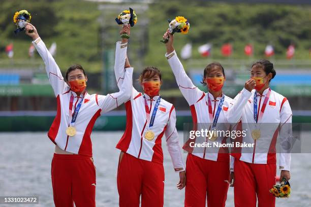 Yunxia Chen, Ling Zhang, Yang Lyu and Xiaotong Cui of Team China poses with the gold medal after winning the Women's Quadruple Sculls Final A on day...