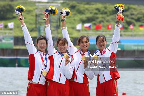 Yunxia Chen, Ling Zhang, Yang Lyu and Xiaotong Cui of Team China poses with the gold medal after winning the Women's Quadruple Sculls Final A on day...