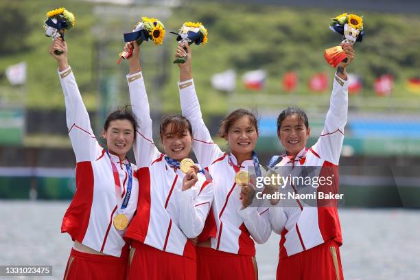 Yunxia Chen, Ling Zhang, Yang Lyu and Xiaotong Cui of Team China poses with the gold medal after winning the Women's Quadruple Sculls Final A on day...