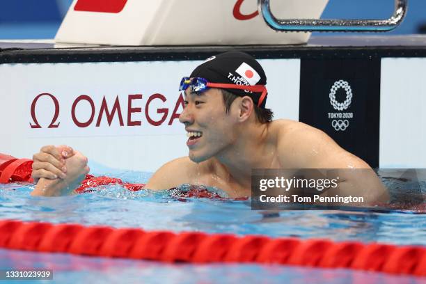 Tomoru Honda celebrates winning the silver medal in the Men's 200m Butterfly Final on day five of the Tokyo 2020 Olympic Games at Tokyo Aquatics...