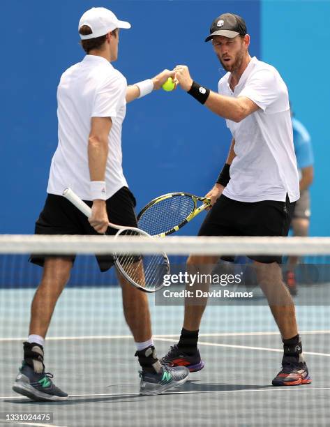 Michael Venus of Team New Zealand and Marcus Daniell of Team New Zealand play against Robert Farah of Team Colombia and Juan-Sebastian Cabalon of...