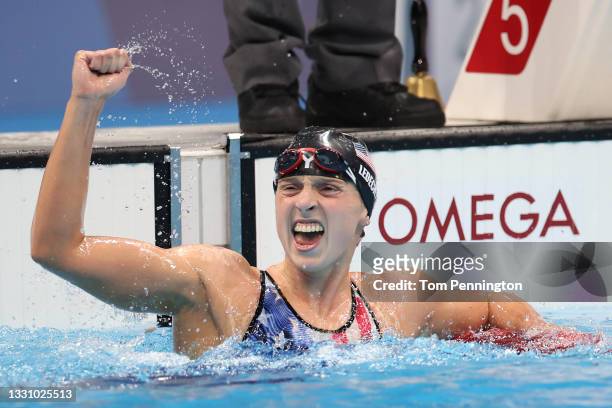 Katie Ledecky of Team United States celebrates after winning the gold medal in the Women's 1500m Freestyle Final on day five of the Tokyo 2020...