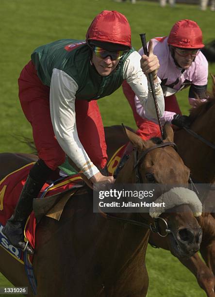 August 10: Richard Hughes of The Great Britain and Ireland Team celebrates as he and his mount King's Welcome land The Carvill Shergar Cup Challenge...