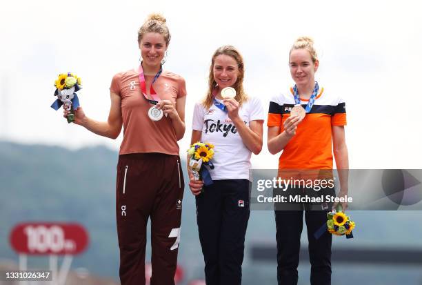 Silver medalist Marlen Reusser of Team Switzerland, gold medalist Annemiek van Vleuten of Team Netherlands, and bronze medalist Anna van der Breggen...