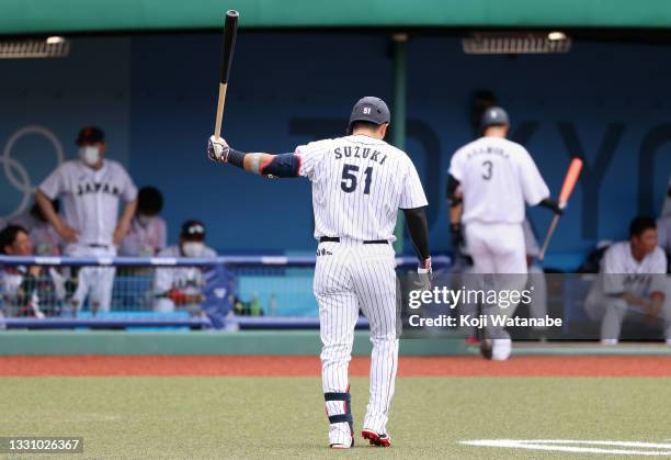 Seiya Suzuki of Team Japan reacts on his way back to the dugout after striking out swinging in the sixth inning against Team Dominican Republic...