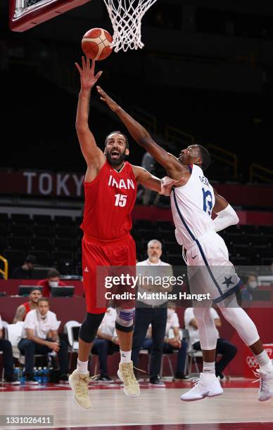 Arsalan Kazemi of Team Iran goes up for a shot against Bam Adebayo of Team United States during the first half of a Men's Preliminary Round Group A...