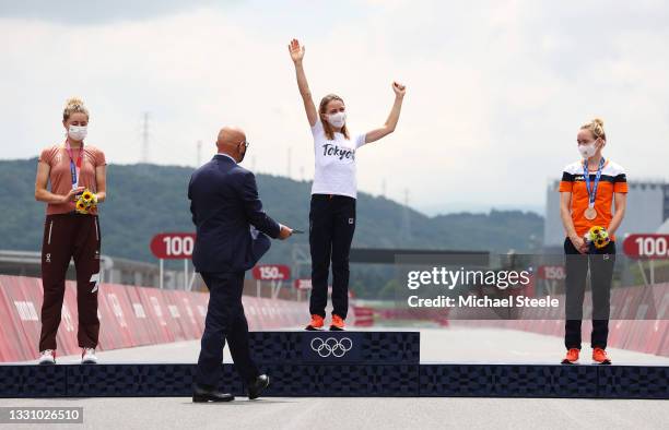Annemiek van Vleuten of Team Netherlands is awarded the gold medal by Mr Ivo Ferriani of Italy IOC Executive board member while silver medalist...
