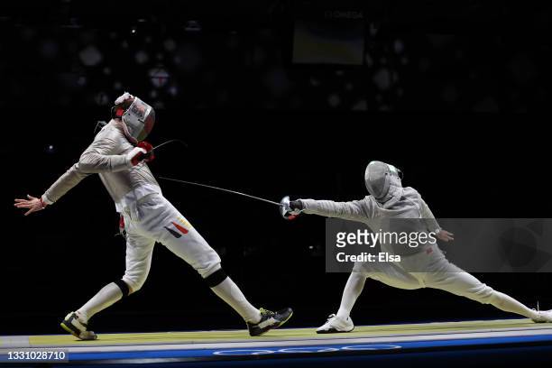 Bongil Gu of Team South Korea, right, competes against Benedikt Wagner of Team Germany in Men's Sabre Team on day five of the Tokyo 2020 Olympic...