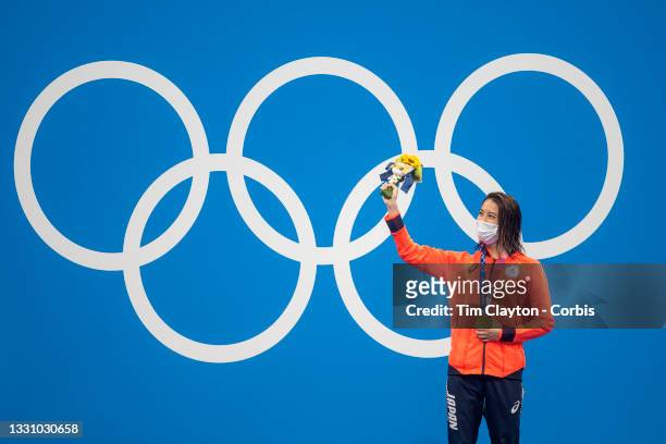 Yui Oahshi of Japan on the podium after winning the gold medal in the 200m Individual Medley for women during the Swimming Finals at the Tokyo...