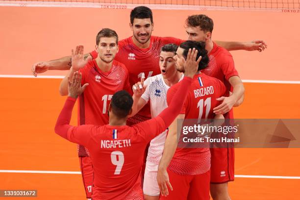 Team France celebrate against Team Argentina during the Men's Preliminary Round - Pool B volleyball on day five of the Tokyo 2020 Olympic Games at...