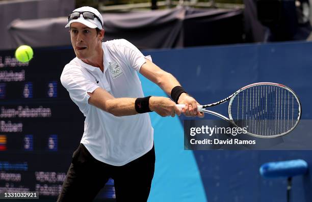 Michael Venus of Team New Zealand plays a backhand during his Men's Doubles Quarterfinal match with Marcus Daniell of Team New Zealand against Robert...