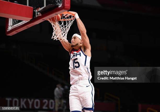 Devin Booker of Team United States dunks against Islamic Republic of Iran during a Men's Preliminary Round Group A game on day five of the Tokyo 2020...