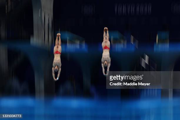 Zongyuan Wang and Siyi Xie of Team China compete during the Men's Synchronised 3m Springboard final on day five of the Tokyo 2020 Olympic Games at...