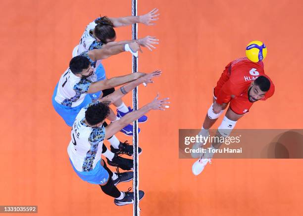 Earvin Ngapeth of Team France hits against Team Argentina during the Men's Preliminary Round - Pool B volleyball on day five of the Tokyo 2020...