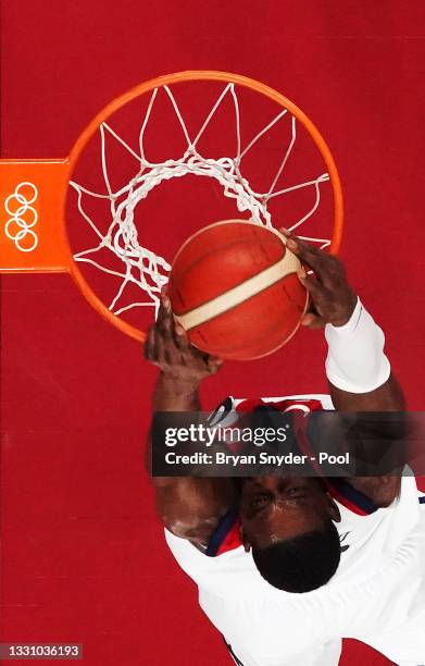 Khris Middleton of Team United States dunks against Iran during a Men's Preliminary Round Group A game on day five of the Tokyo 2020 Olympic Games at...