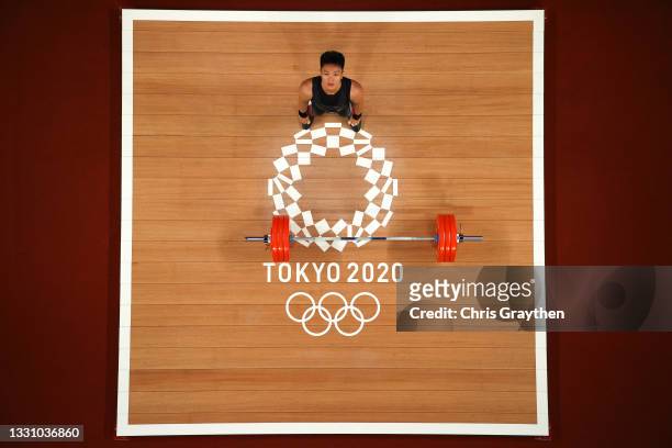 Rahmat Erwin Abdullah of Team Indonesia competes during the Weightlifting - Men's 73kg Group B on day five of the Tokyo Olympic Games at Tokyo...