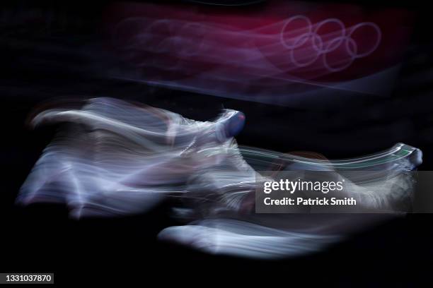 Luigi Samele of Team Italy and Aron Szilagyi of Team Hungary compete in the match in Men's Sabre Team Semi-final on day five of the Tokyo 2020...