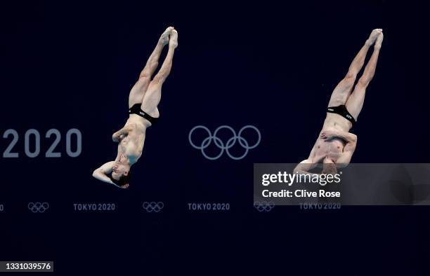 Patrick Hausding and Lars Rudiger of Germany compete during the Men's Synchronised 3m Springboard final on day five of the Tokyo 2020 Olympic Games...