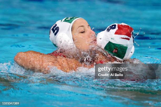 Gabriella Szucs and Rita Keszthelyi of Team Hungary celebrate their 10-9 win during the Women's Preliminary Round Group B match between Hungary and...