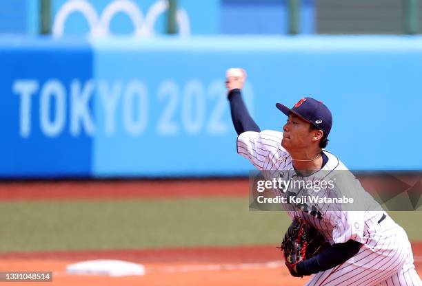 Pitcher Yoshinobu Yamamoto of Team Japan pitches in the second inning against Team Dominican Republic during the baseball opening round Group A game...