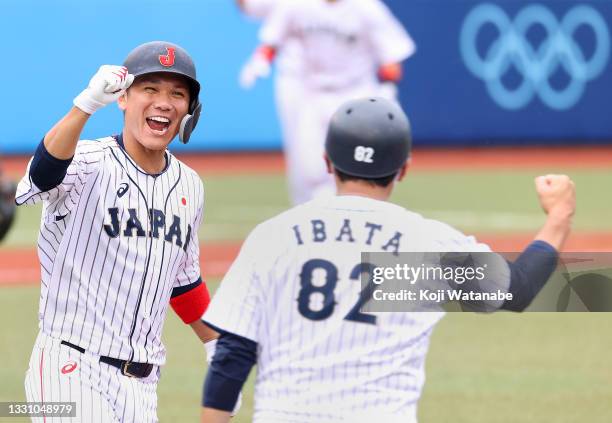 Hayato Sakamoto of Team Japan celebrates his walk-off single to center field to win 4-3 against Team Dominican Republic during the baseball opening...