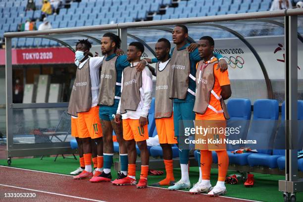 Zie Ouattara, Nicolas Tie, Amad Diallo, Silas Gnaka, Maxime Nagoli and Cheick Timite of Team Ivory Coast stand for the national anthem prior to the...