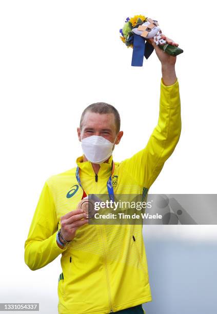 Rohan Dennis of Team Australia poses with the bronze medal after the Men's Individual time trial on day five of the Tokyo 2020 Olympic Games at Fuji...