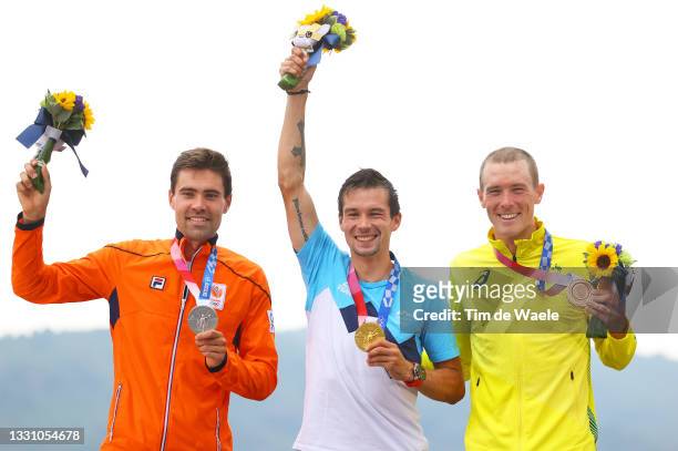 Silver medalist Tom Dumoulin of Team Netherlands, gold medalist Primoz Roglic of Team Slovenia, and bronze medalist Rohan Dennis of Team Australia,...