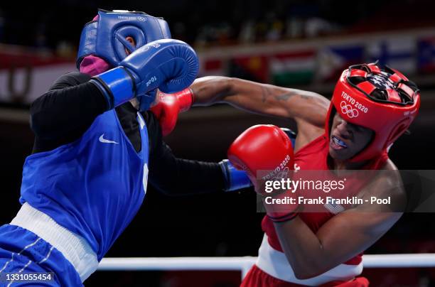 Naomi Graham of the United States exchanges punches with Zenfira Magomedalieva of Russian Olympic Committee during the Women's Middle on day five of...