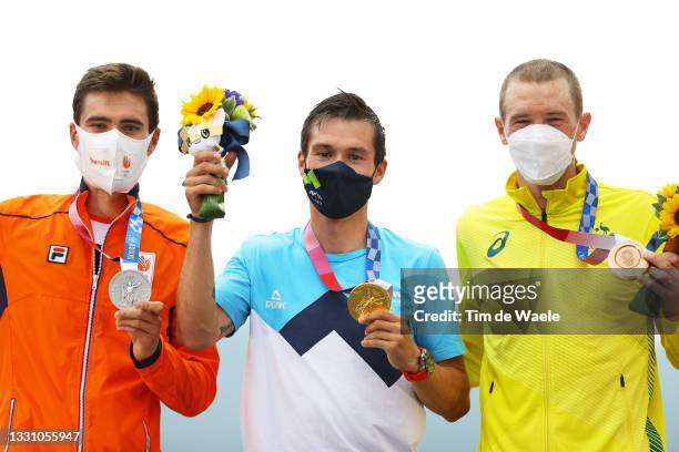 Silver medalist Tom Dumoulin of Team Netherlands, gold medalist Primoz Roglic of Team Slovenia, and bronze medalist Rohan Dennis of Team Australia,...