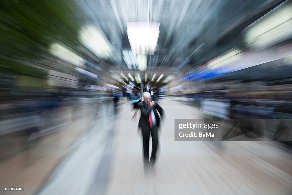 Businessman Walking Through Financial District